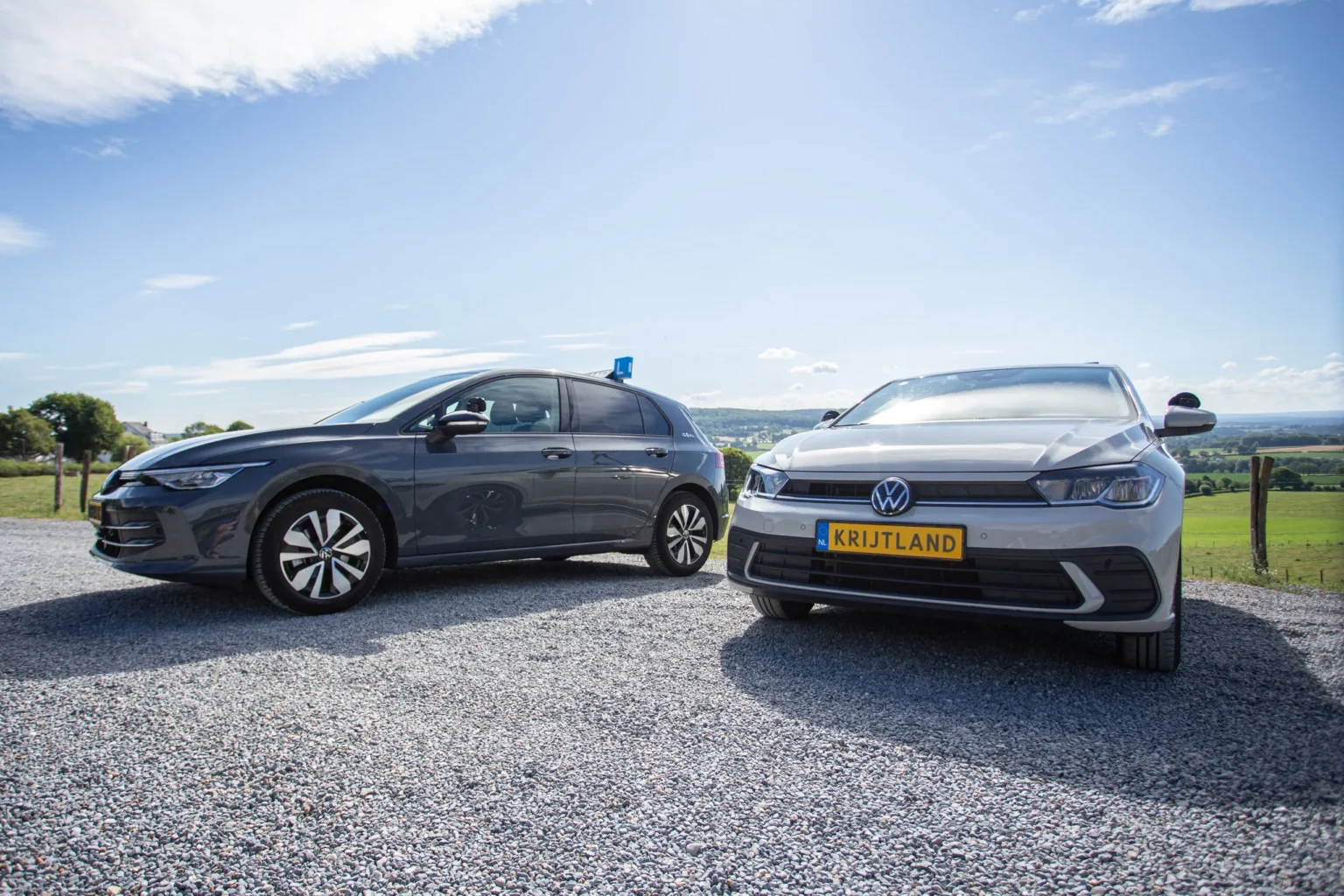 Two Autorijschool Krijtland driving school cars in the hills of South Limburg